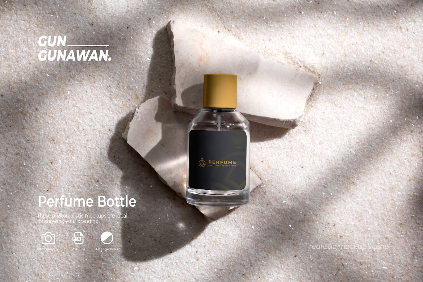 石头和白沙背景上的香水瓶 (PSD)