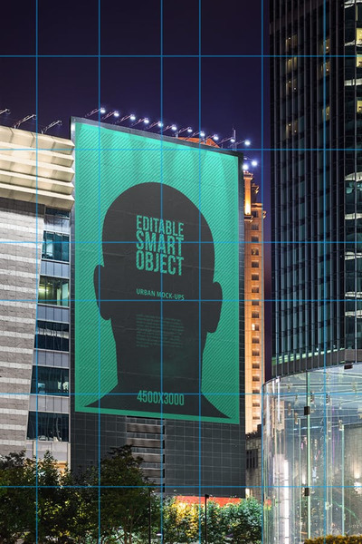 城市夜晚楼宇楼身大幅带射灯的广告样机[PSD]
