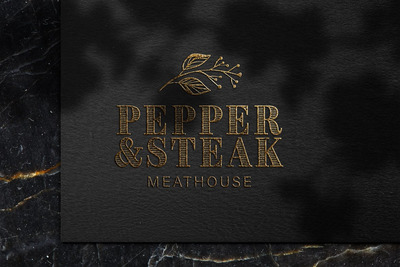 黑色纸张上的奢华浮雕金色标志模型样机（PSD）