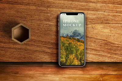 木桌纹理背景iPhone手机样机 (PSD)